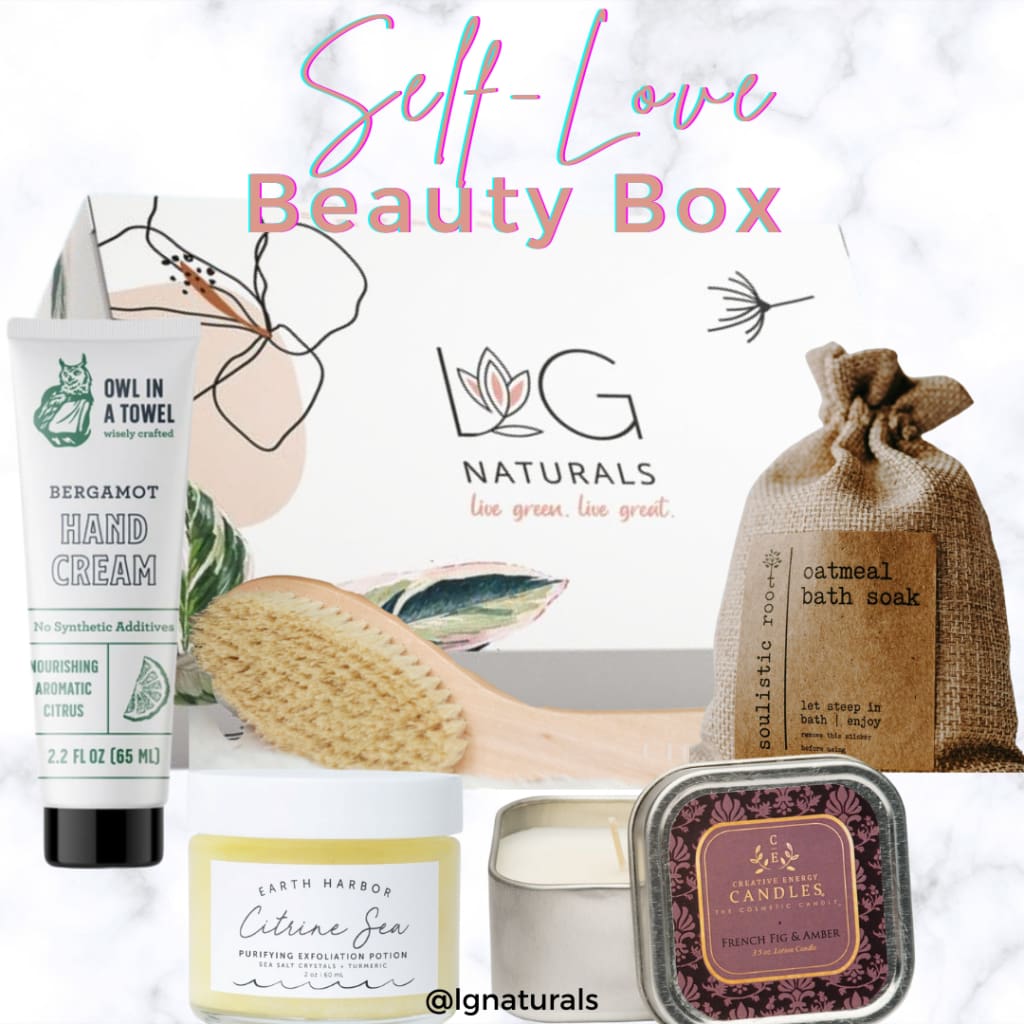February Self Love Box, hand cream, oatmeal bath soak, 2 in 1 vegan & soy candle lotion, 3 in 1 exfoliator, cleanser and mask. Vegan Dry Brush made from eco friendly materials.